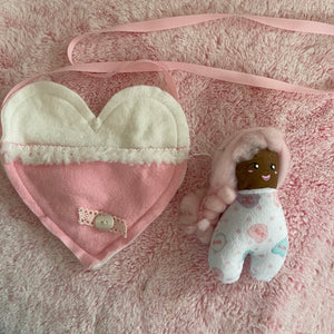 Pink hair doll’s doll with heart bag