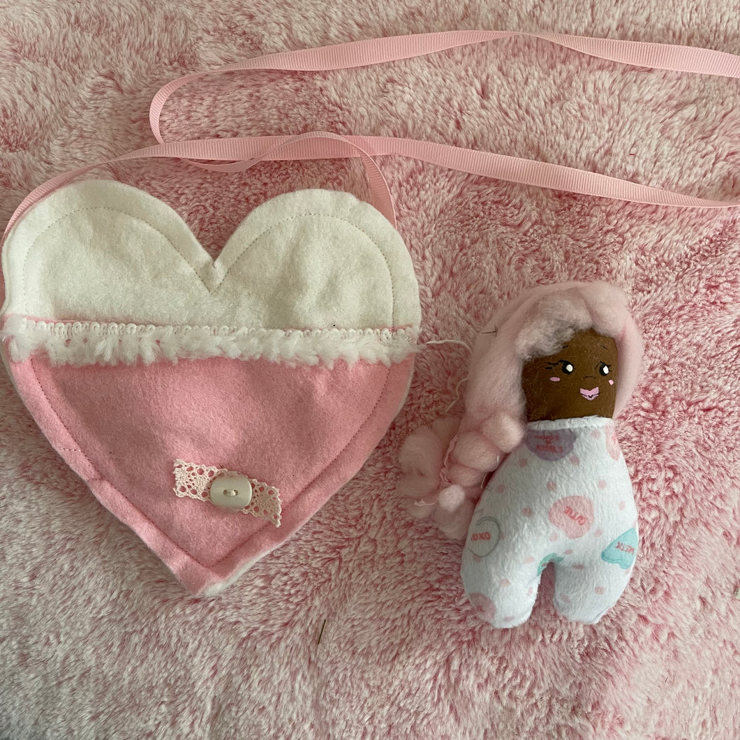 Pink hair doll’s doll with heart bag